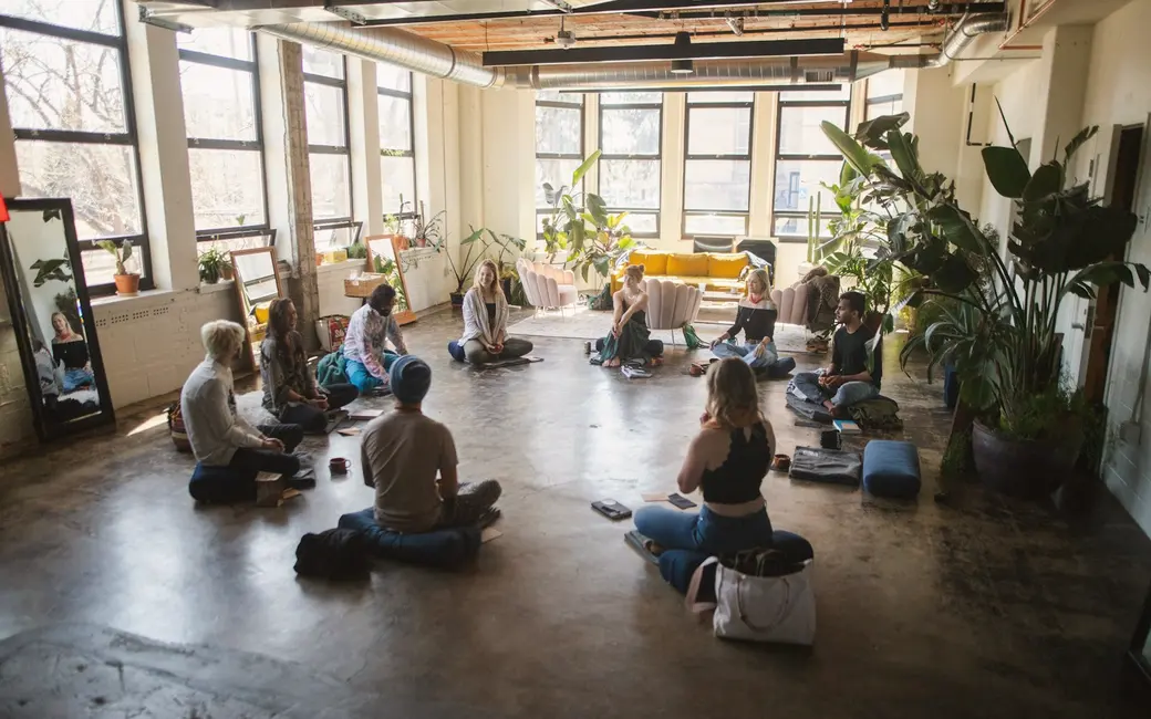 A warm, sunlit workshop circle